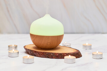 Aroma oil diffuser on table at home. Aromatherapy concept