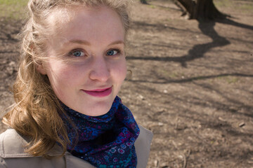 young pretty blonde girl enjoing spring nature in park, lifestyle people concept close up