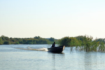 Danube Delta landscape with fishing boat in Romania