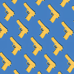 Yellow handgun pattern on dark blue background. Yellow pistol pattern. Flat lay gun minimal concept. Security inspiration. Paintball competition.