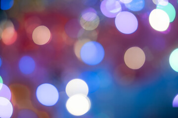 Multicolor glow of garlands in blur