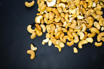 cashew nuts top view black background closeup