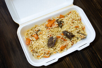 delicious Asian pilaf in a white bowl.