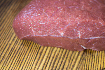 fresh veal meat close-up on wooden background