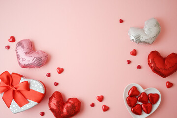 Happy Valentines day background with heart shapes, chocolates and gift box. Top view with copy space