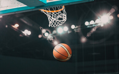 Basketball going through the hoop at a sports arena
