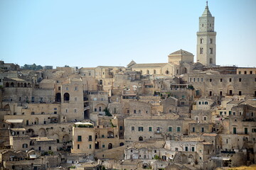 Obraz premium ITALY-Matera is a city located on a rocky outcrop in Basilicata, in Southern Italy. It includes the Sassi area, a complex of Cave Houses carved into the mountain