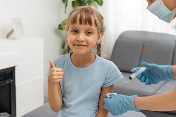 Little girl getting vaccination from pediatrician at medical office