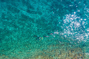 Diving in crystal clear sea near village of Stomorska on Šolta Island in Croatia in summer