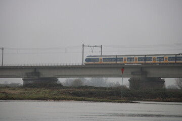 Fototapeta na wymiar train bridge over river