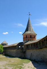 Fototapeta premium Kamyanets Podilskyi, Ukraine: Kamianets-Podilskyi Castle with view of the castle wall and tower from inside the castle grounds.