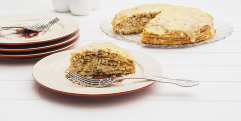 Lasagna's assembly on a white table.