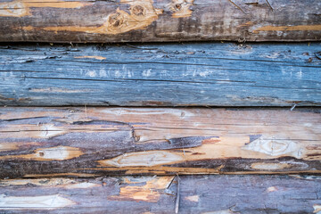 Wall of an old wooden log house. Copy space. 