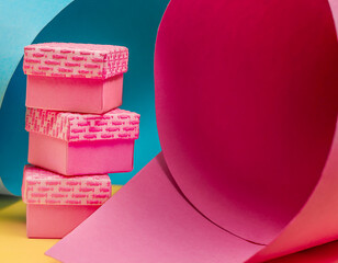 Several small gift boxes on a colorful background
