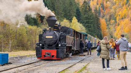 Fototapeta na wymiar Steam train Mocanita at the railway station in Romania