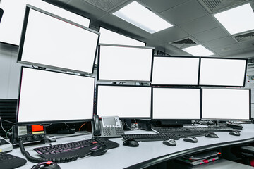 group of blank monitors and screen on security desk or control room for monitor process or stock data trading