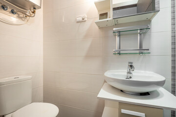 Small bathroom with porcelain sink and toilet