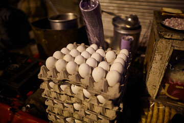 Chicken eggs standing on the street in India. You can imagine how delicious omelets are prepared outside. 