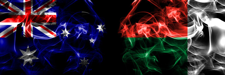 Flags of Australia, Australian vs Madagascar. Smoke flag placed side by side on black background