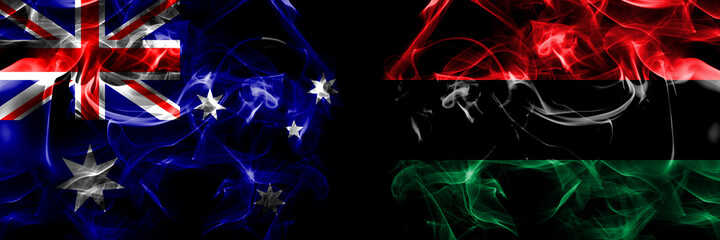 Flags of Australia, Australian vs Organizations, Pan african, UNIA. Smoke flag placed side by side on black background - obrazy, fototapety, plakaty