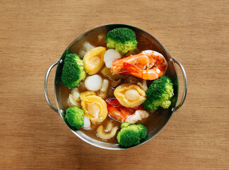 Special Delicacy with Abalone in metal bowl on wood table