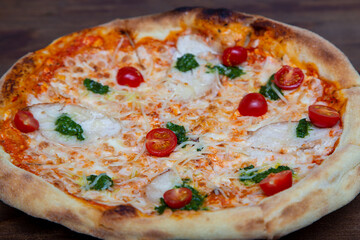Pizza close up. Fresh homemade Italian pizza Margherita with mozzarella and basil