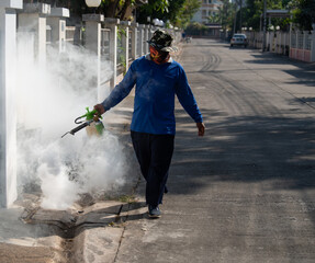 Health workers are spraying mosquitoes in the village.
