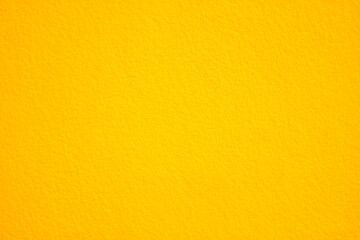 Yellow concrete wall texture with empty copy space