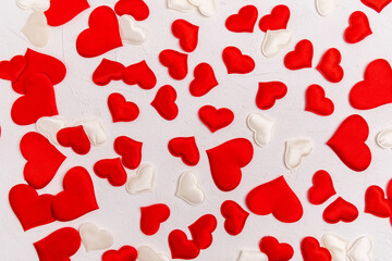 Toy red hearts over white background. Valentines Day Symbols. Top view