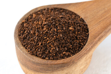 Ground Coffee in a Wood Scoop