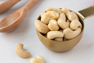 Raw Cashews in a Measuring Cup