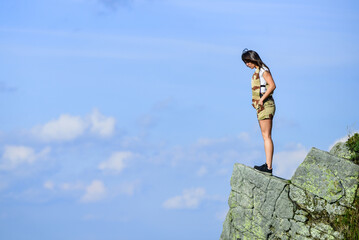 Depression concept. Soldier girl. Military female. Observing point. Brave girl dangerous cliff....