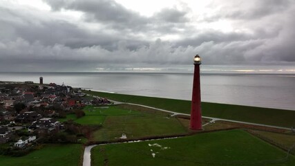 Lighthouse tower Lange Jaap in Den Helder drone aerial footage along the sea near the island of Texel in North Holland, The Netherlands.