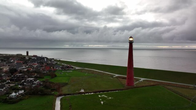 Lighthouse tower Lange Jaap in Den Helder drone aerial footage along the sea near the island of Texel in North Holland, The Netherlands.