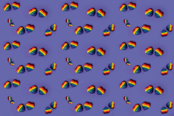 Colorful rainbow painted hearts on a very peri (purple) background wallpapers suitable for Valentine days. Valentine concept