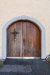 Fototapeta na wymiar Old and beautiful ornate door with cross decoration