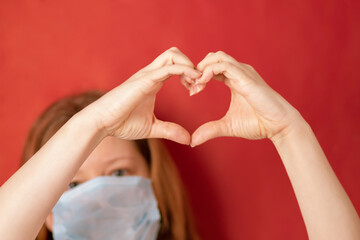 blood donor day,donor woman after blood donation procedure on red background