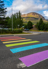 Rainbow marked crosswalk supporting equal rights for LGBT people community. Reydarfjordur - Eastfjords (Austfirðir), Iceland - obrazy, fototapety, plakaty