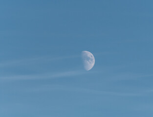 Moon in daylight with thin clouds a winter day in Stockholm