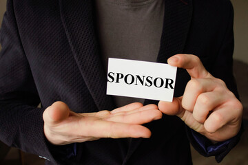 Business concept. Paper with text SPONSORS WELCOME, near a calculator, chart,magnifier