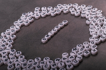 the words covid, omicron, are written in letters on a gray background. there are a lot of toy inscriptions nearby.