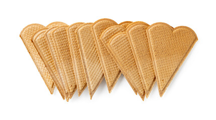 Heap of sweet heart shaped wafers for ice cream decoration isolated on a white background. Thin flat waffle biscuits for dessert garnishing macro. Pastry pattern for Valentine day food design.