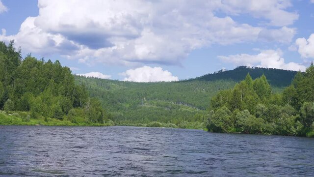 Middle Siberia, Krasnoyarsk Territory. Hilly (coniform hill) river bank. Taiga mixed forests