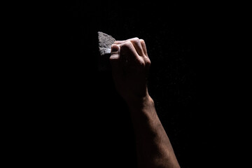 Climbing grip full crimp on black background