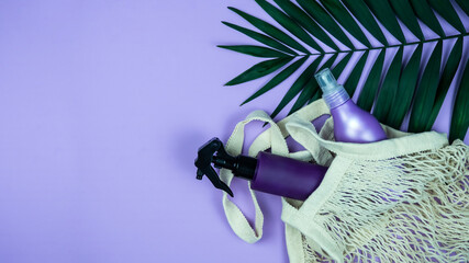 Lilac, purple cosmetic bottle mockup, tubes, dispenser with palm leaves. Product branding, spa,...