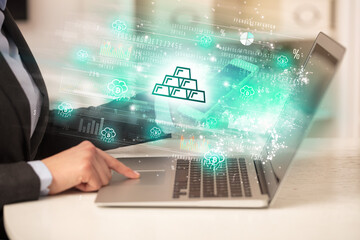 Young man watching stock market on laptop