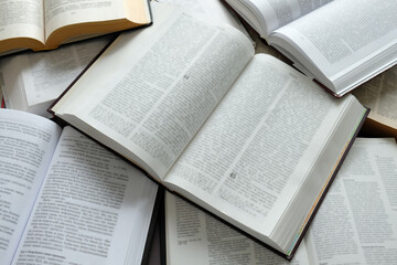 Fototapeta premium There are a lot of open books on the table. 