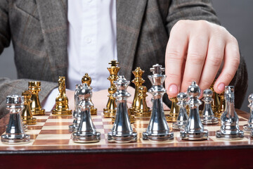 A man plays chess at the table.