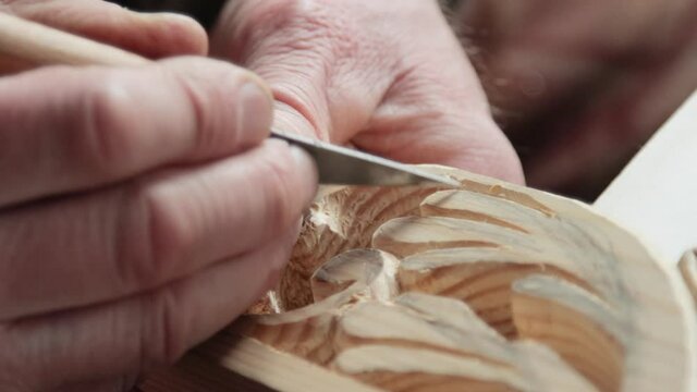 Closeup shoot of a woodcarver at work