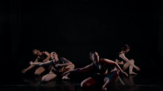 young ladies are performing contemporary choreography on scene, students of school of arts